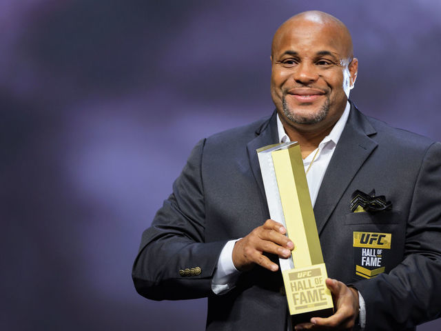 LAS VEGAS, NEVADA - JUNE 30: Daniel Cormier receives his trophy and jacket during the UFC Hall of Fame induction ceremony at T-Mobile Arena on June 30, 2022 in Las Vegas, Nevada.