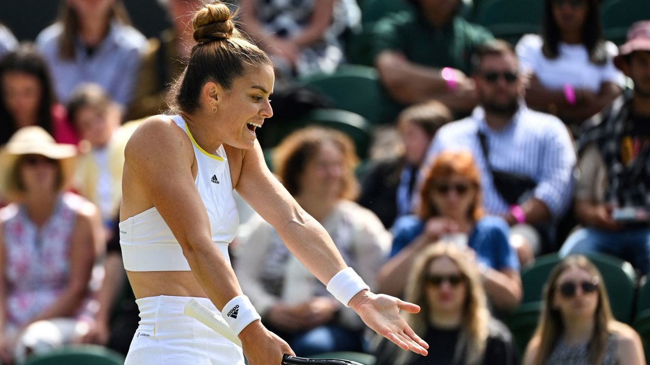 Greece's Maria Sakkari reacts as she plays against Germany's Tatjana Maria during their women's singles tennis match on the fifth day of the 2022 Wimbledon Championships at The All England Tennis Club in Wimbledon, southwest London, on July 1, 2022. - RESTRICTED TO EDITORIAL USE