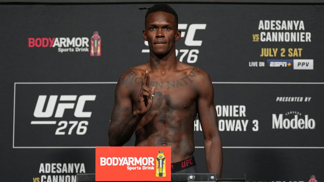 LAS VEGAS, NEVADA - JULY 01: Israel Adesanya of Nigeria poses on the scale during the UFC 276 official weigh-in at UFC APEX on July 01, 2022 in Las Vegas, Nevada.
