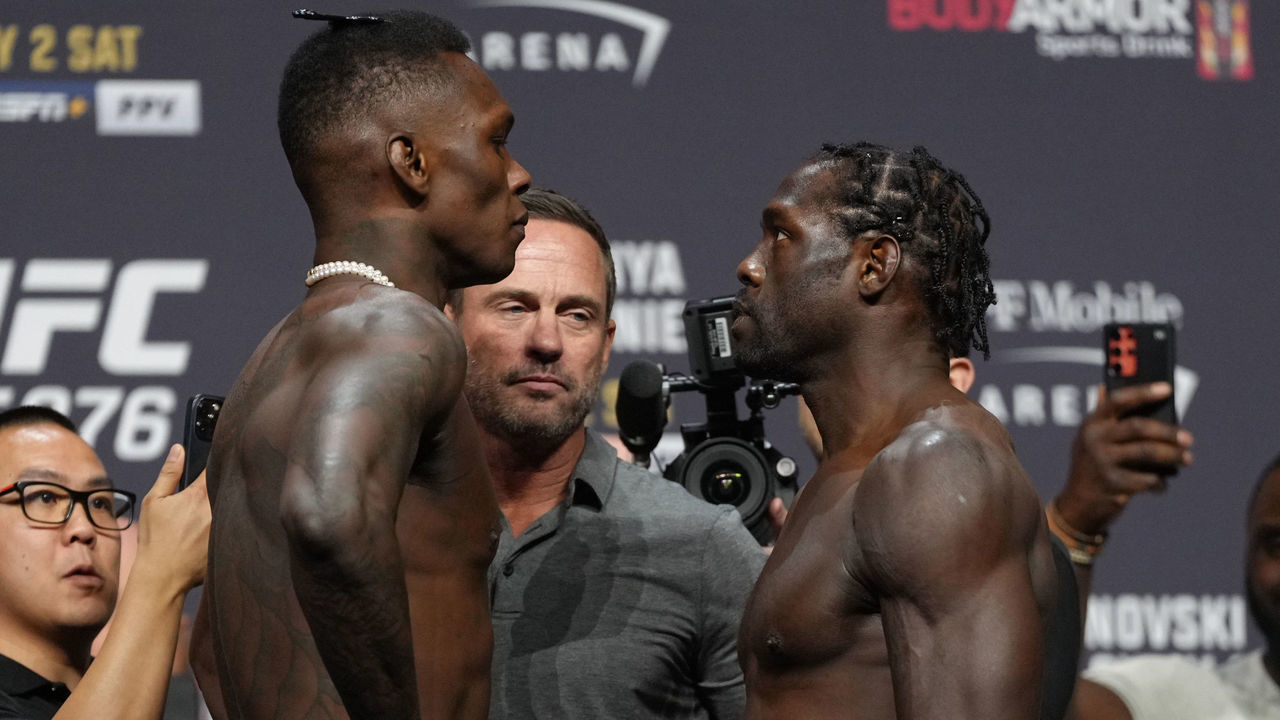 LAS VEGAS, NEVADA - JULY 01: (L-R) Opponents Israel Adesanya of Nigeria and Jared Cannonier face off during the UFC 276 ceremonial weigh-in at T-Mobile Arena on July 01, 2022 in Las Vegas, Nevada.