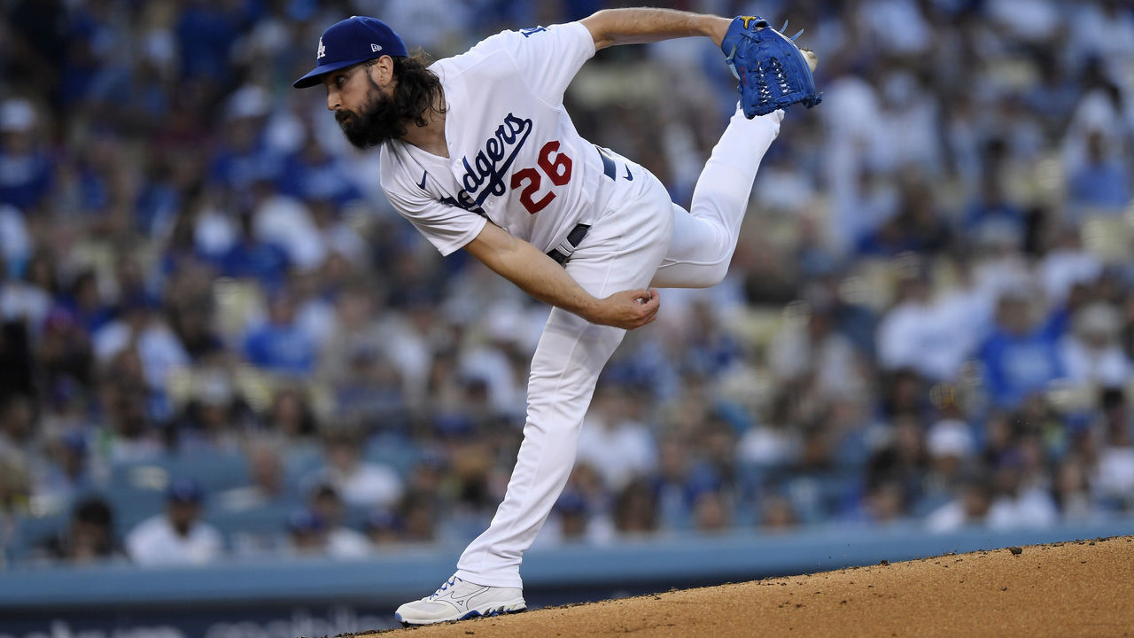 LOS ANGELES, CA - JULY 01: Starting pitcher Tony Gonsolin #26 of the Los Angeles Dodgers throws a pitch against Jake Cronenworth #9 of the San Diego Padres during the third inning at Dodger Stadium on July 1, 2022 in Los Angeles, California.