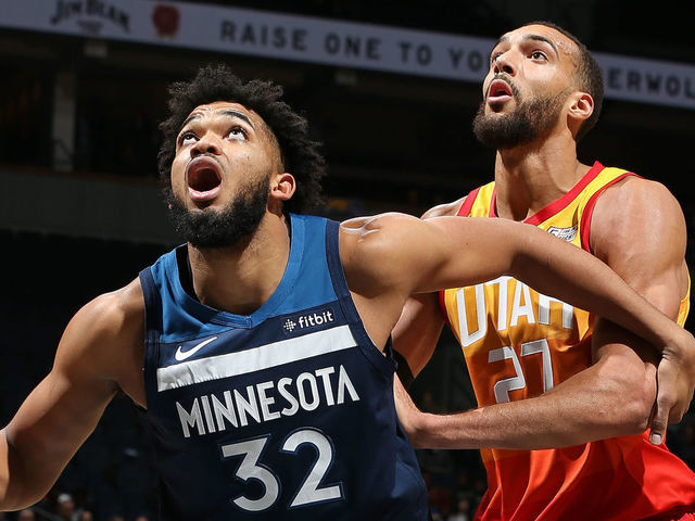 MINNEAPOLIS, MN - DECEMBER 11: Karl-Anthony Towns #32 of the Minnesota Timberwolves boxes out Rudy Gobert #27 of the Utah Jazz on December 11, 2019 at Target Center in Minneapolis, Minnesota. Mandatory Copyright Notice: Copyright 2019 NBAE