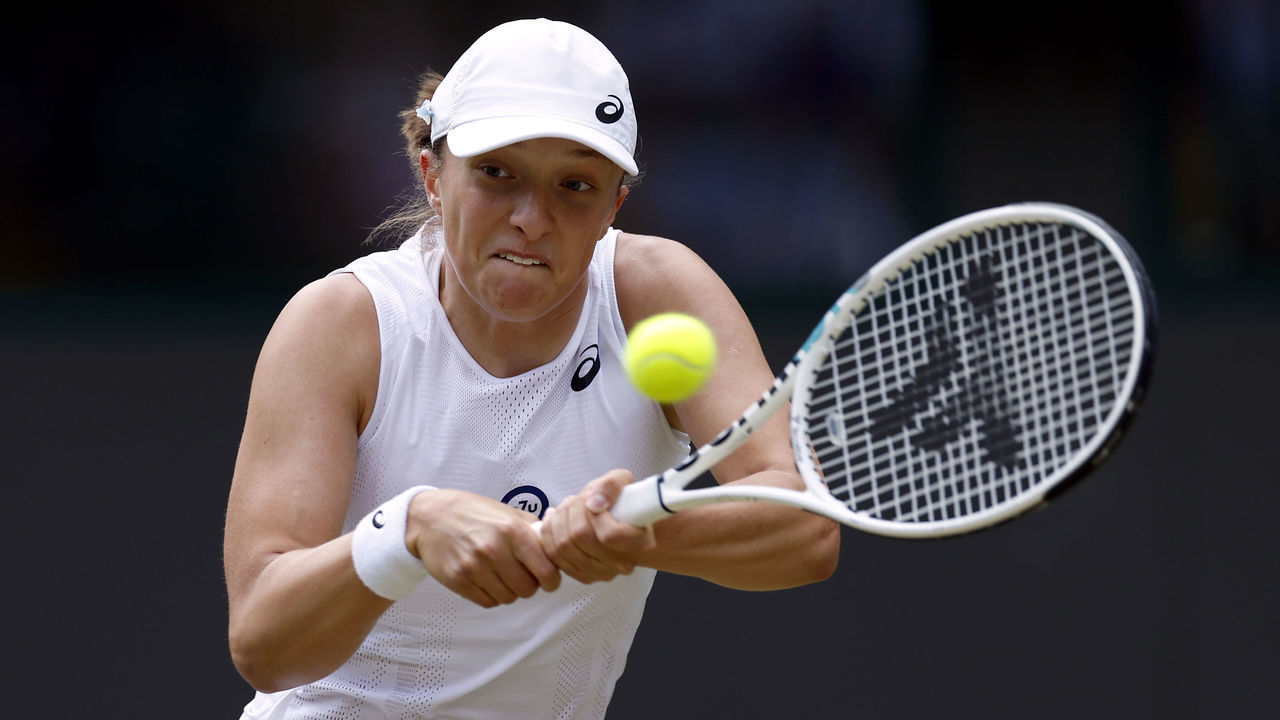 Iga Swiatek in action during her Ladies Singles third round match against Alize Cornet during day six of the 2022 Wimbledon Championships at the All England Lawn Tennis and Croquet Club, Wimbledon. Picture date: Saturday July 2, 2022.