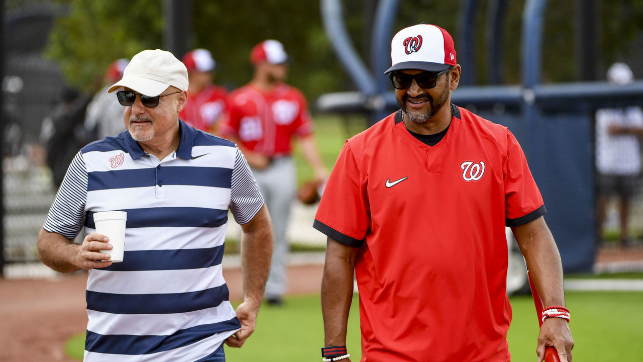 WEST PALM BEACH, FL - FEBRUARY 20 Washington Nationals General Manager Mike Rizzo and manager Dave Martinez (4) walk the fields checking out players during spring training drills at The Washington Nationals Spring Training Complex.
