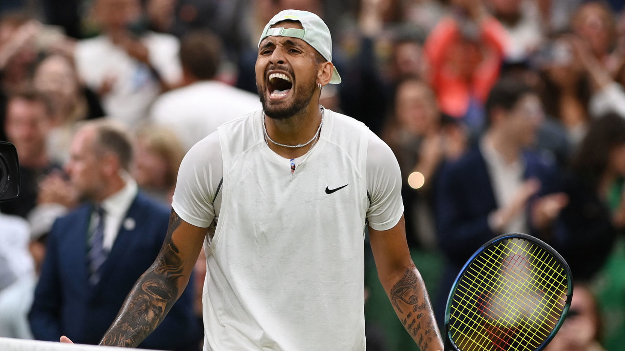 Australia's Nick Kyrgios celebrates beating Greece's Stefanos Tsitsipas during their men's singles tennis match on the sixth day of the 2022 Wimbledon Championships at The All England Tennis Club in Wimbledon, southwest London, on July 2, 2022. - RESTRICTED TO EDITORIAL USE