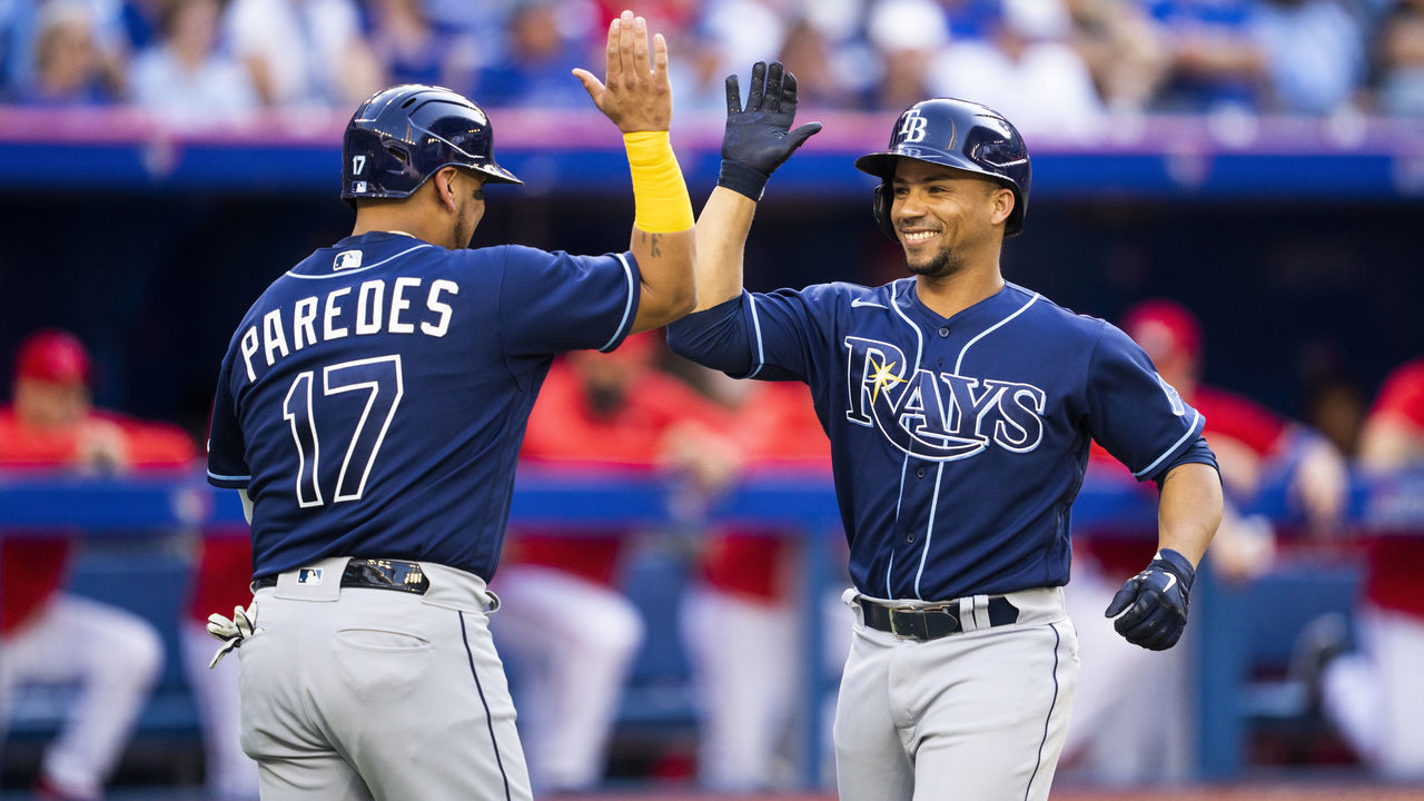 TORONTO, ON - JULY 2: Francisco Mejia #21 of the Tampa Bay Rays celebrates his home run with Isaac Paredes #17 against the Toronto Blue Jays in the second inning during game two of a doubleheader at the Rogers Centre on July 2, 2022 in Toronto, Ontario, Canada.