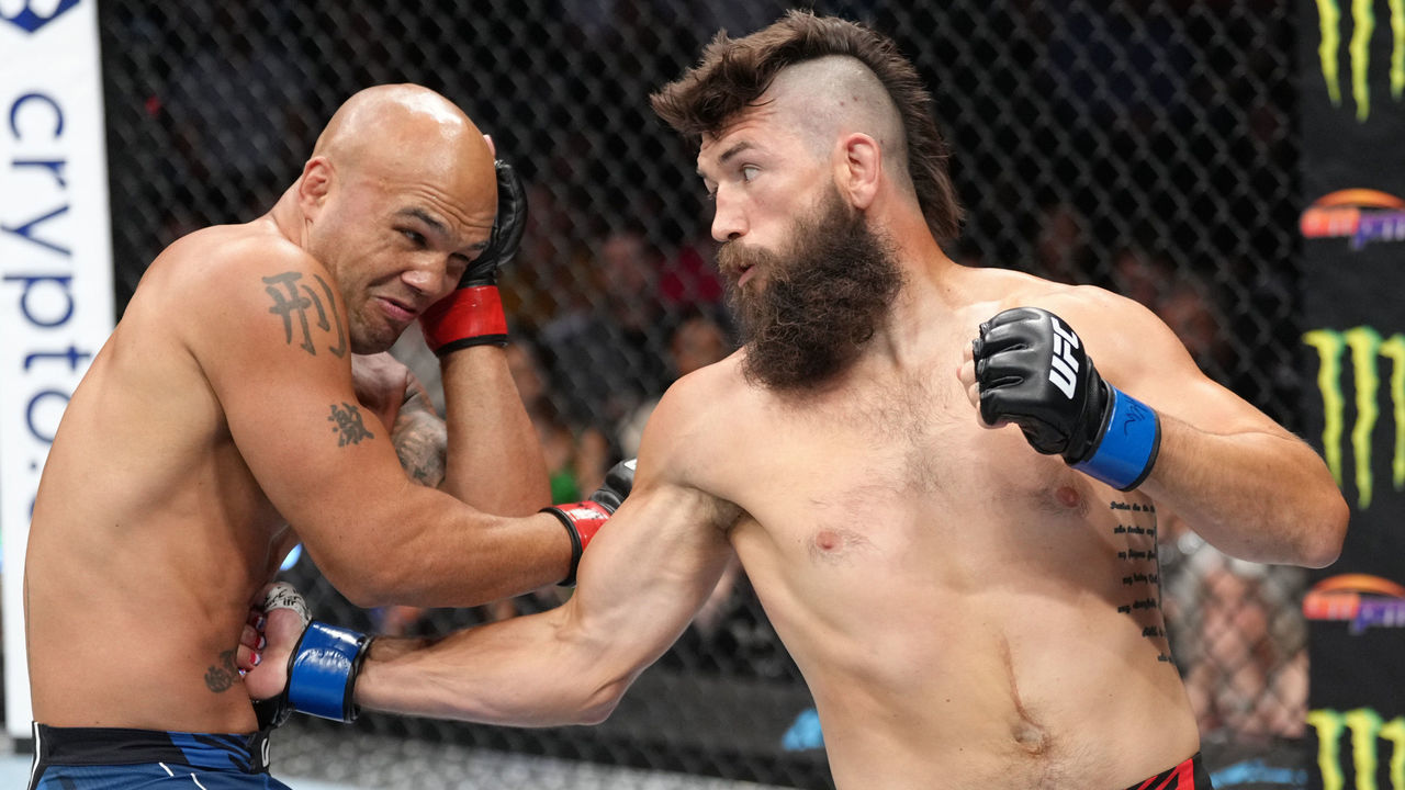 LAS VEGAS, NEVADA - JULY 02: Bryan Barberena punches Robbie Lawler in a welterweight fight during the UFC 276 event at T-Mobile Arena on July 02, 2022 in Las Vegas, Nevada.