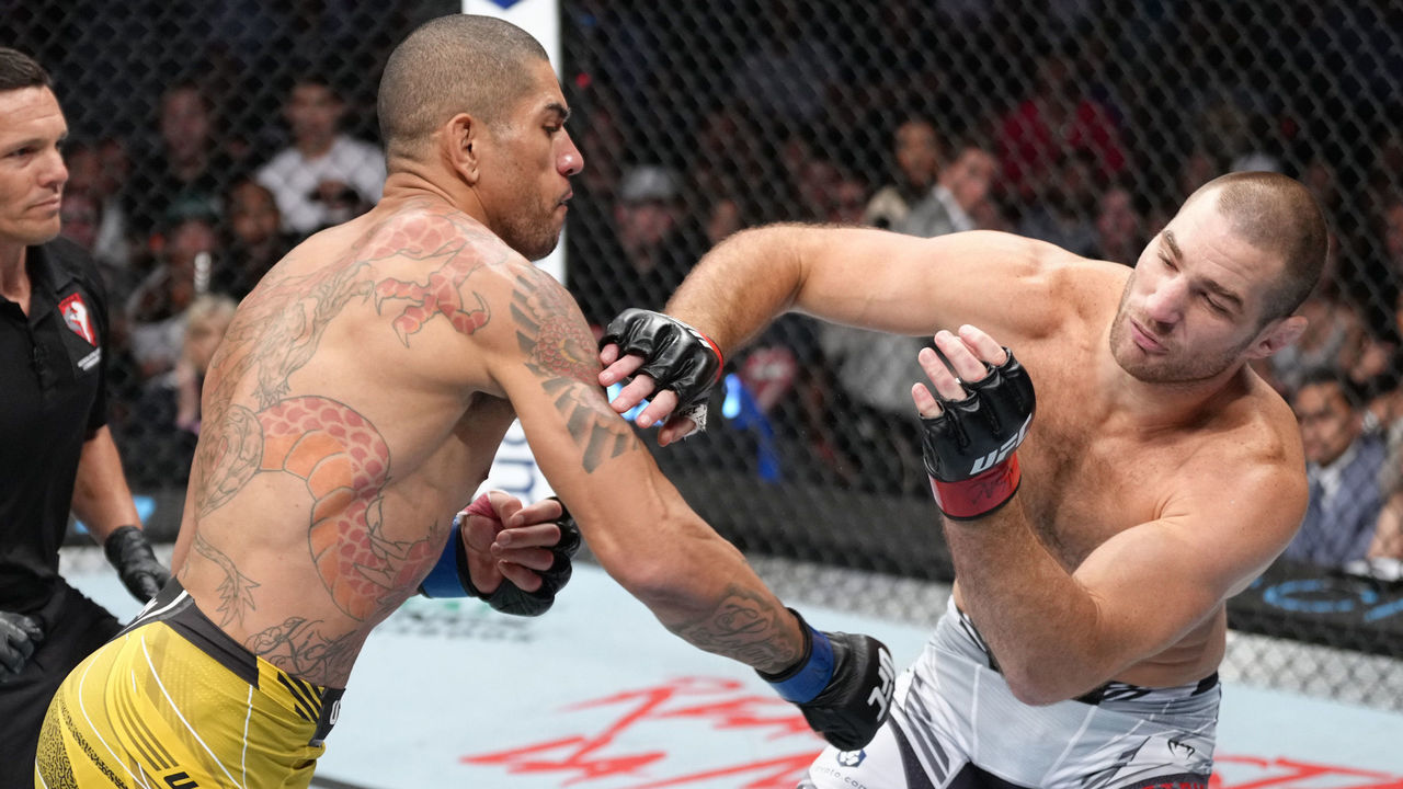LAS VEGAS, NEVADA - JULY 02: Alex Pereira of Brazil punches Sean Strickland during the UFC 276 event at T-Mobile Arena on July 02, 2022 in Las Vegas, Nevada.