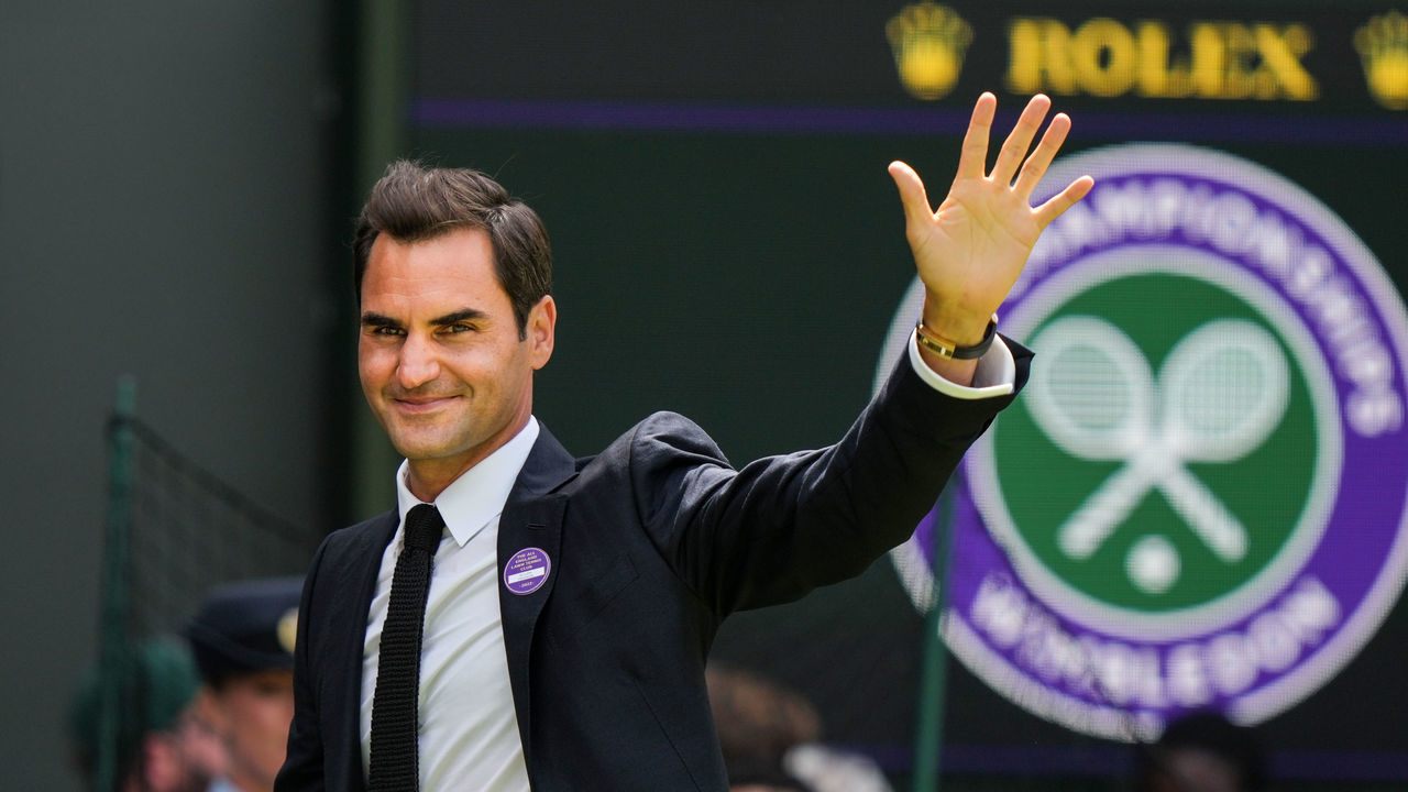 LONDON, ENGLAND - JULY 03: Roger Federer of Switzerland greets the audience during the Centre Court Centenary Celebration during day seven of The Championships Wimbledon 2022 at All England Lawn Tennis and Croquet Club on July 03, 2022 in London, England.