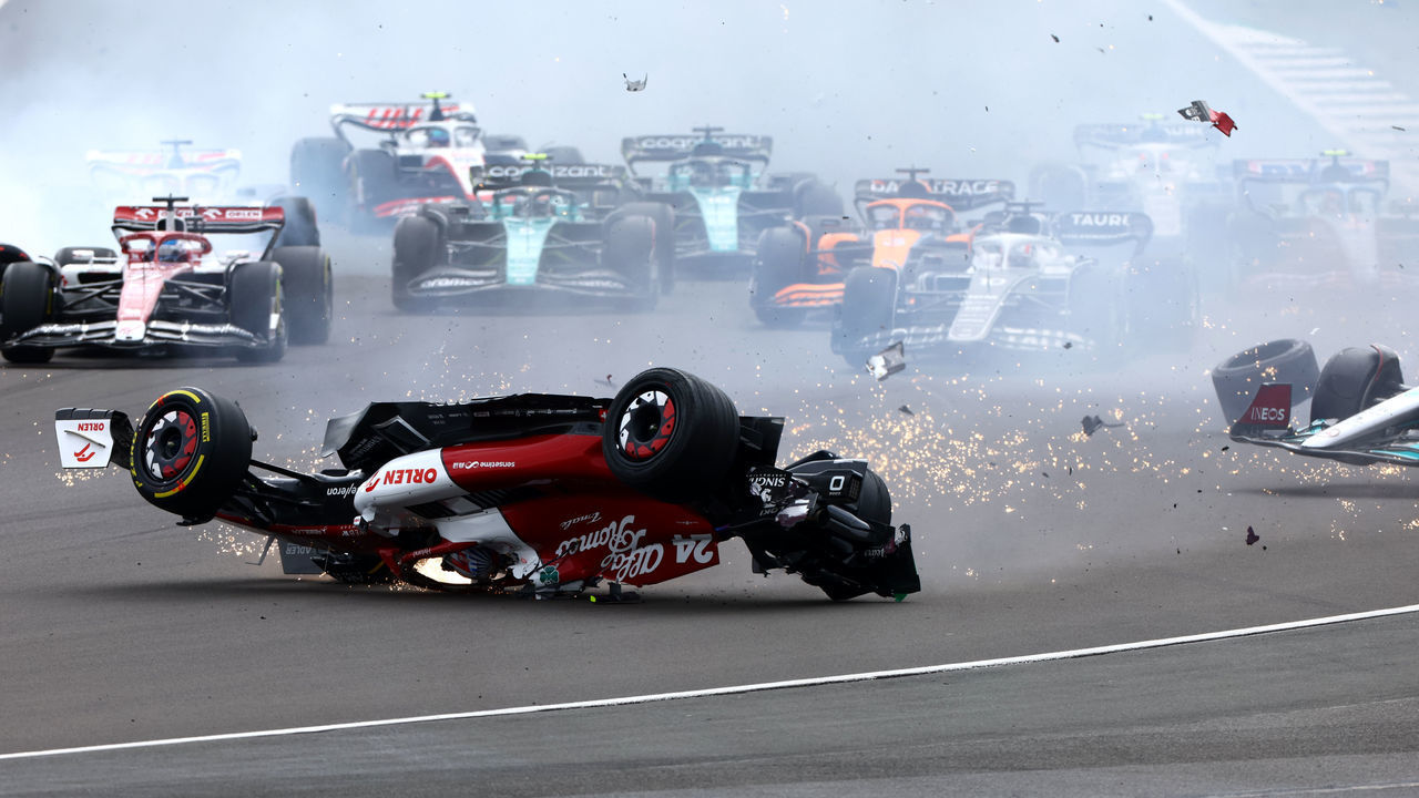 NORTHAMPTON, ENGLAND - JULY 03: Zhou Guanyu of China driving the (24) Alfa Romeo F1 C42 Ferrari crashes at the start during the F1 Grand Prix of Great Britain at Silverstone on July 03, 2022 in Northampton, England.