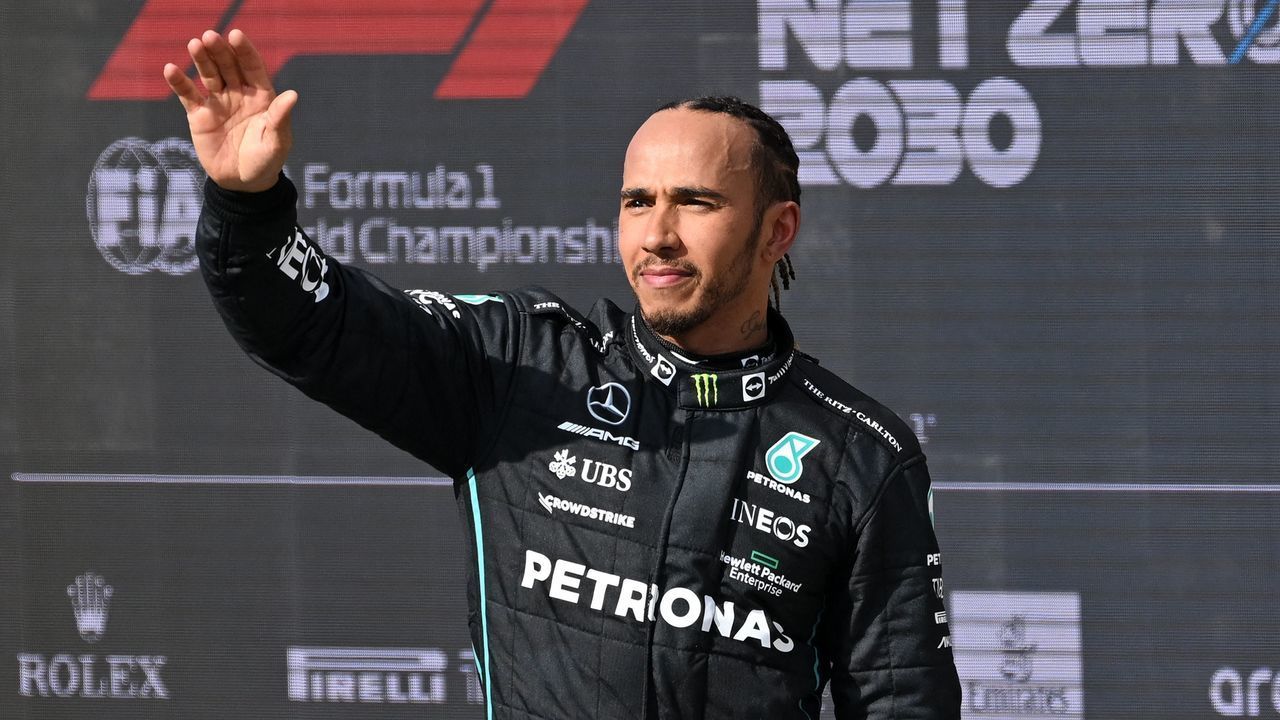 Third-placed Mercedes' British driver Lewis Hamilton waves to the crowd after the Formula One British Grand Prix at the Silverstone motor racing circuit in Silverstone, central England on July 3, 2022.