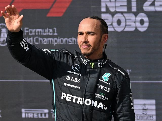 Third-placed Mercedes' British driver Lewis Hamilton waves to the crowd after the Formula One British Grand Prix at the Silverstone motor racing circuit in Silverstone, central England on July 3, 2022.