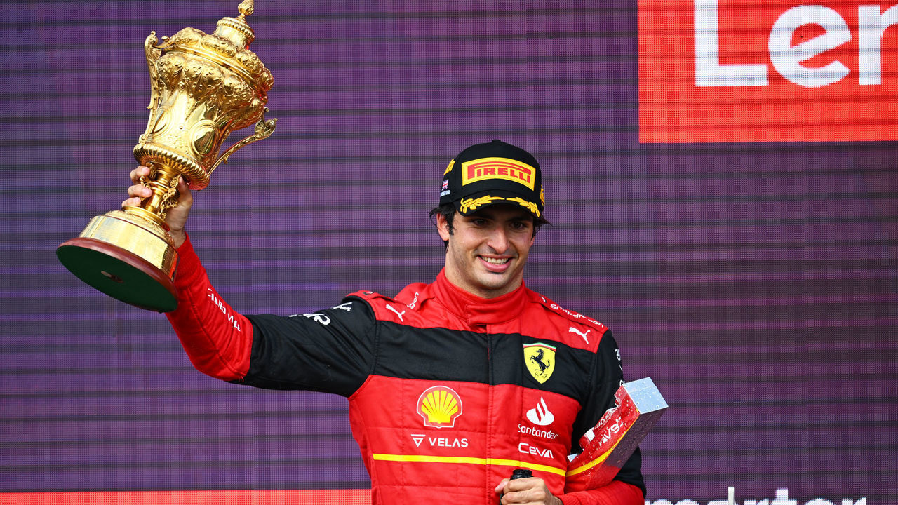 NORTHAMPTON, ENGLAND - JULY 03: Race winner Carlos Sainz of Spain and Ferrari celebrates on the podium during the F1 Grand Prix of Great Britain at Silverstone on July 03, 2022 in Northampton, England.