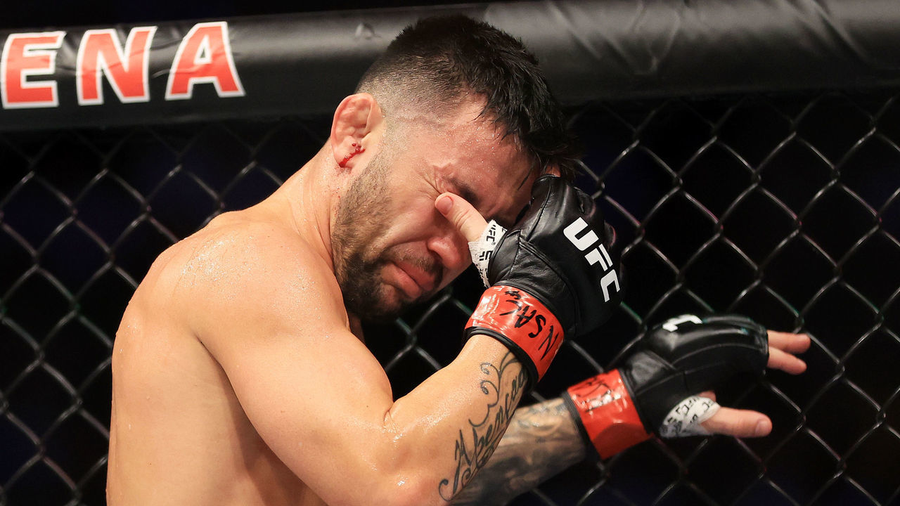 LAS VEGAS, NEVADA - JULY 02: Pedro Munhoz of Brazil reacts after an unintentional eye poke from Sean O'Malley in their bantamweight bout during UFC 276 at T-Mobile Arena on July 02, 2022 in Las Vegas, Nevada. The fight was ruled a no contest.