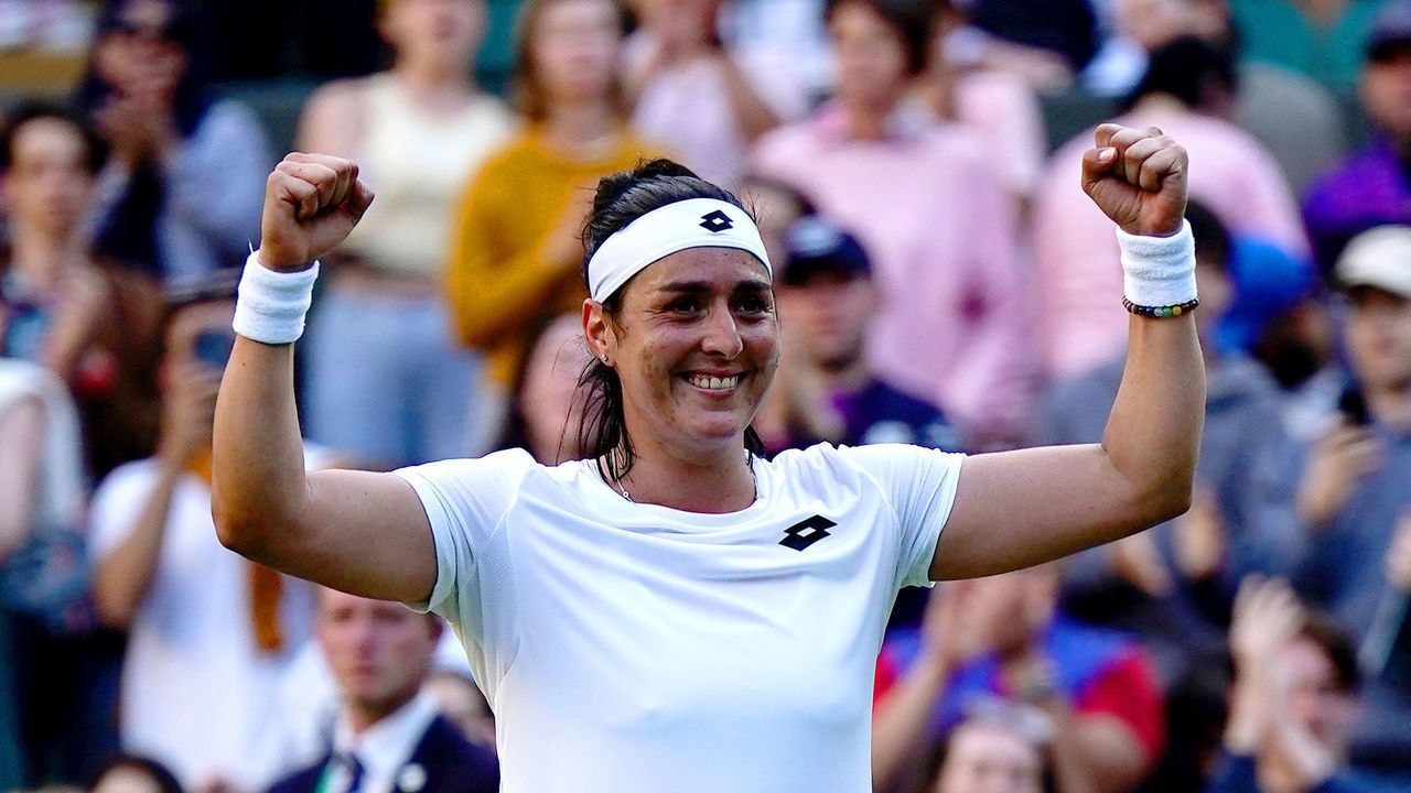 Ons Jabeur celebrates winning her Ladies' Singles fourth round match against Elise Mertens on court 1 during day seven of the 2022 Wimbledon Championships at the All England Lawn Tennis and Croquet Club, Wimbledon. Picture date: Sunday July 3, 2022.