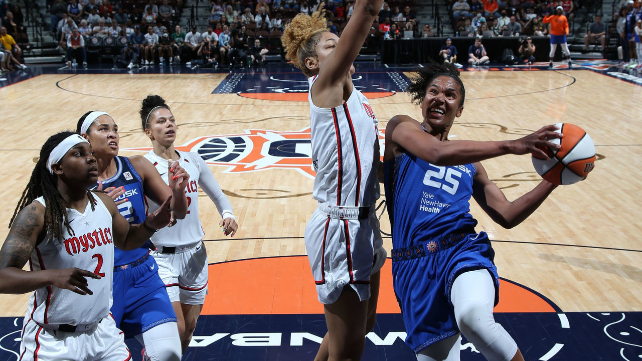UNCASVILLE, CT - JULY 3: Alyssa Thomas #25 of the Connecticut Sun drives to the basket during the game against the Washington Mystics on July 3, 2022 at Mohegan Sun Arena in Uncasville, Connecticut. NOTE TO USER: User expressly acknowledges and agrees that, by downloading and/or using this Photograph, user is consenting to the terms and conditions of the Getty Images License Agreement. Mandatory Copyright Notice: Copyright 2022 NBAE