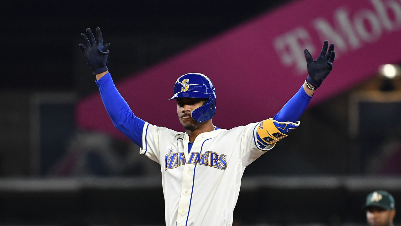 SEATTLE, WASHINGTON - JULY 03: Julio Rodriguez #44 of the Seattle Mariners gestures after hitting an RBI double during the sixth inning against the Oakland Athletics at T-Mobile Park on July 03, 2022 in Seattle, Washington.