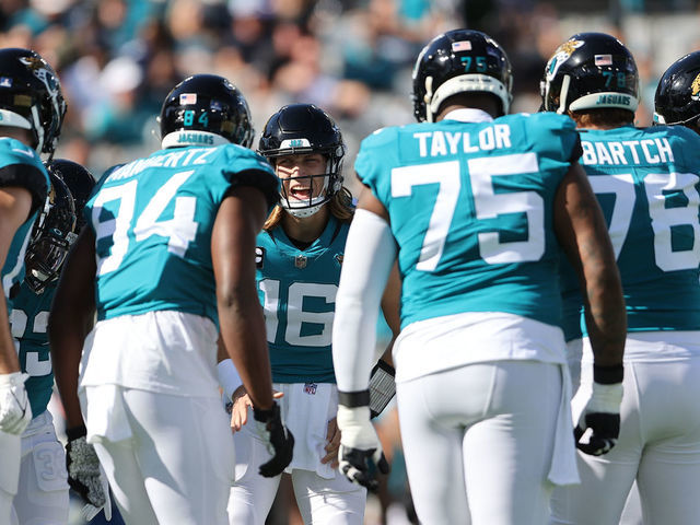 JACKSONVILLE, FL - JANUARY 09: Jacksonville Jaguars quarterback Trevor Lawrence (16) calls the play in t he huddle during the game between the Indianapolis Colts and the Jacksonville Jaguars on January 9, 2022 at TIAA Bank Field in Jacksonville, FL
