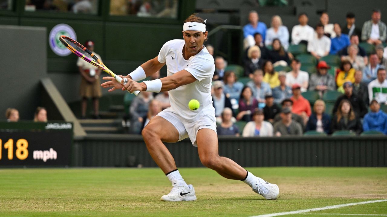 Spain's Rafael Nadal returns the ball to Netherlands' Botic van de Zandschulp during their round of 16 men's singles tennis match on the eighth day of the 2022 Wimbledon Championships at The All England Tennis Club in Wimbledon, southwest London, on July 4, 2022. - RESTRICTED TO EDITORIAL USE