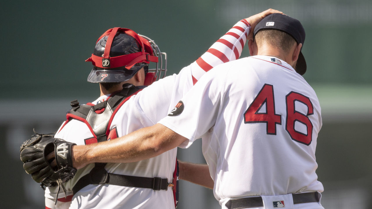 BOSTON, MA - JULY 4: John Schreiber #46 of the Boston Red Sox reacts with Christian Vázquez #7 of the Boston Red Sox after a win against the Tampa Bay Rays on July 4, 2022 at Fenway Park in Boston, Massachusetts.