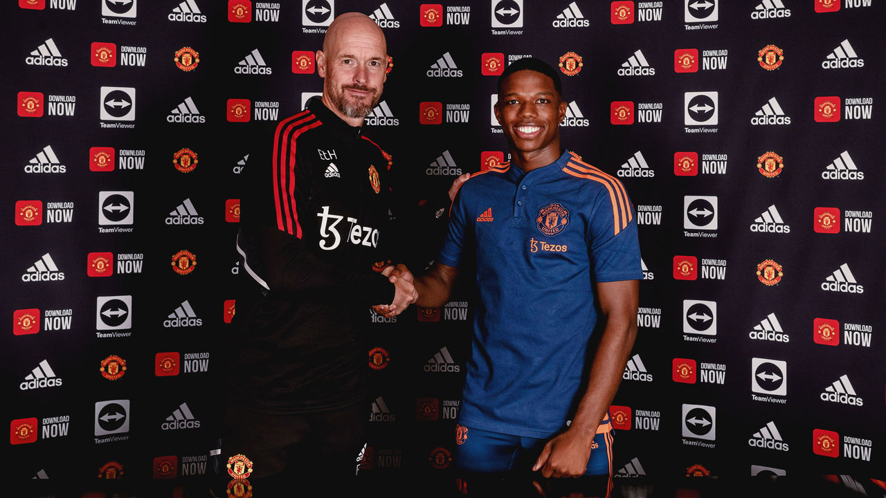 MANCHESTER, ENGLAND - JULY 05: (EXCLUSIVE COVERAGE) Tyrell Malacia of Manchester United poses with Manager Erik ten Hag after signing his contract with the club at Carrington Training Ground on July 05, 2022 in Manchester, England.