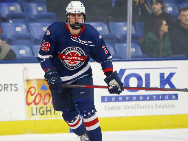 PLYMOUTH, MICHIGAN - JANUARY 17: Cutter Gauthier #19 of Team Blue skates up the ice in the third period of the USA Hockey All-American Game at USA Hockey Arena on January 17, 2022 in Plymouth, Michigan.
