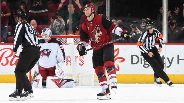 GLENDALE, ARIZONA - NOVEMBER 18: Jakob Chychrun #6 of the Arizona Coyotes skates back to the bench after scoring a shoot out goal against Elvis Merzlikins #90 of the Columbus Blue Jackets at Gila River Arena on November 18, 2021 in Glendale, Arizona.