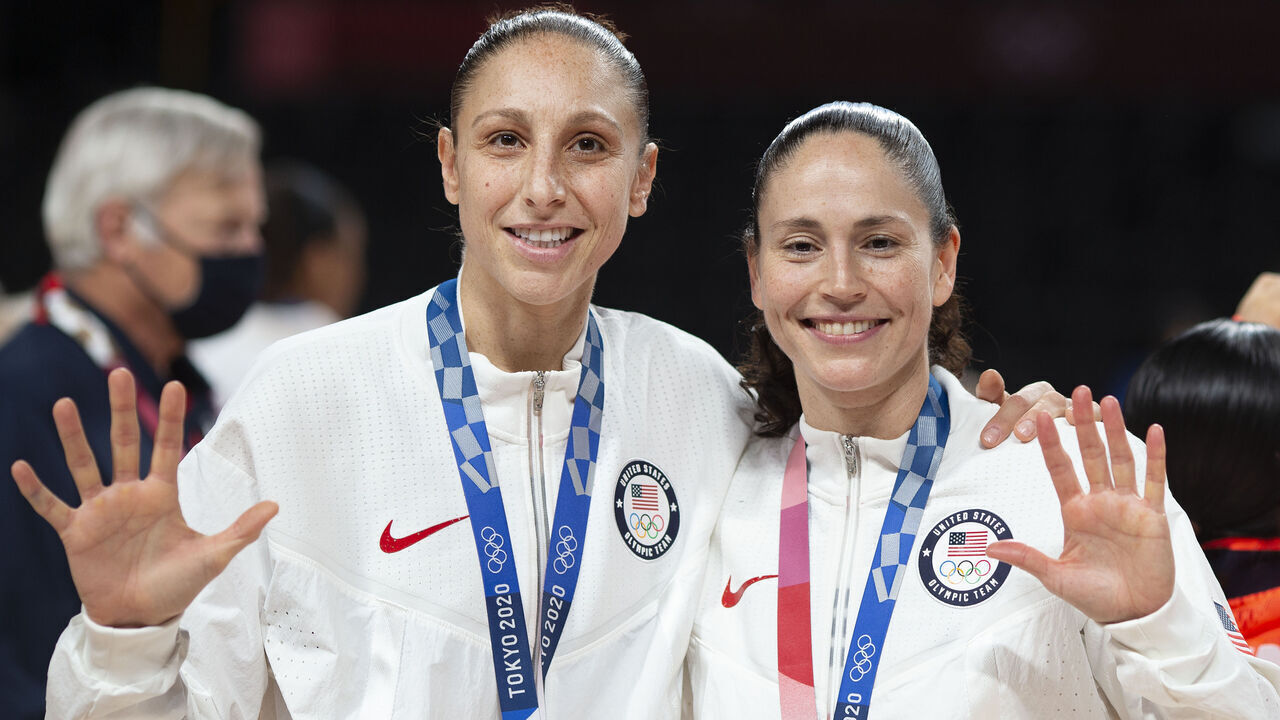TOKYO, JAPAN August 8: Five-time Olympic gold medalists Diana Taurasi #12 of the United States and Sue Bird #6 of the United States with their gold medals at the presentation ceremony after the team victory during the Japan V USA basketball final for women at the Saitama Super Arena during the Tokyo 2020 Summer Olympic Games on August 8, 2021 in Tokyo, Japan.