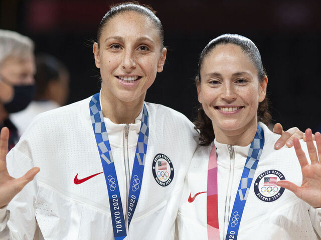 TOKYO, JAPAN August 8: Five-time Olympic gold medalists Diana Taurasi #12 of the United States and Sue Bird #6 of the United States with their gold medals at the presentation ceremony after the team victory during the Japan V USA basketball final for women at the Saitama Super Arena during the Tokyo 2020 Summer Olympic Games on August 8, 2021 in Tokyo, Japan.