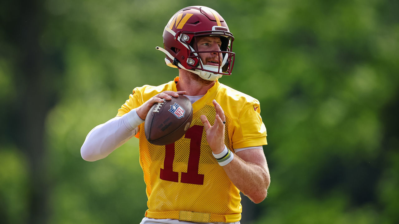 ASHBURN, VA - JUNE 16: Carson Wentz #11 of the Washington Commanders looks to pass during the organized team activity at INOVA Sports Performance Center on June 16, 2022 in Ashburn, Virginia.