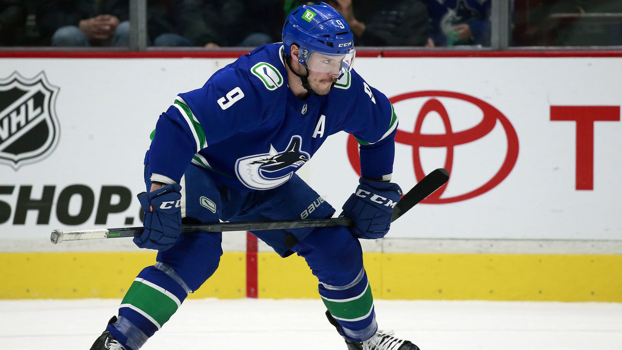 VANCOUVER, BC - MARCH 30: J.T. Miller #9 of the Vancouver Canucks lines up for a face-off during their NHL game against the St. Louis Blues at Rogers Arena March 30, 2022 in Vancouver, British Columbia, Canada. "n