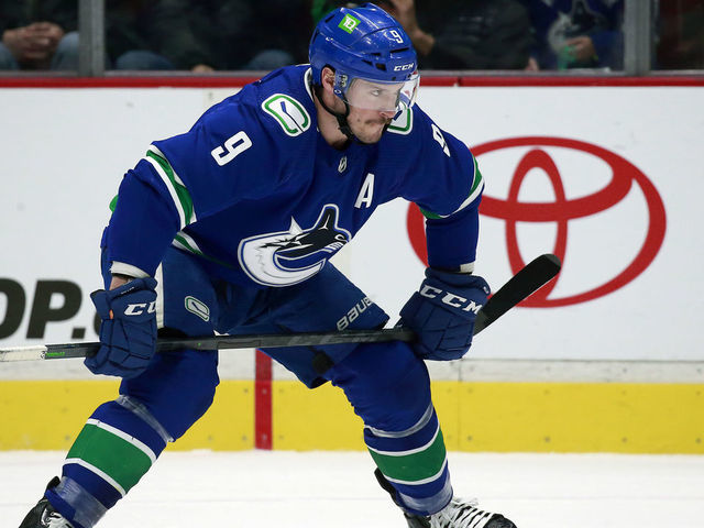 VANCOUVER, BC - MARCH 30: J.T. Miller #9 of the Vancouver Canucks lines up for a face-off during their NHL game against the St. Louis Blues at Rogers Arena March 30, 2022 in Vancouver, British Columbia, Canada. "n