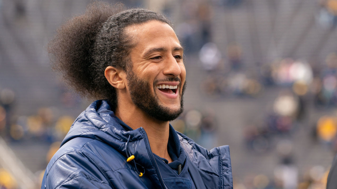 ANN ARBOR, MI - APRIL 02: Colin Kaepernick interacts with fans before the Michigan spring football game at Michigan Stadium on April 2, 2022 in Ann Arbor, Michigan. Kaepernick was honorary captain for the game.
