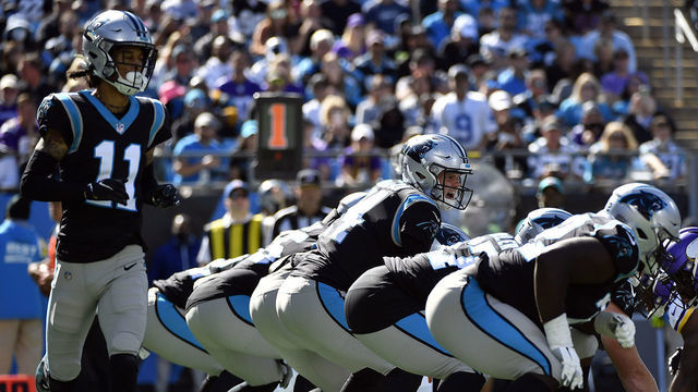 CHARLOTTE, NORTH CAROLINA - OCTOBER 17: Quarterback Sam Darnold #14 waits for the snap as wide receiver Robby Anderson #11 of the Carolina Panthers is in motion during the Panthers' football game against the Minnesota Vikings at Bank of America Stadium on October 17, 2021 in Charlotte, North Carolina.