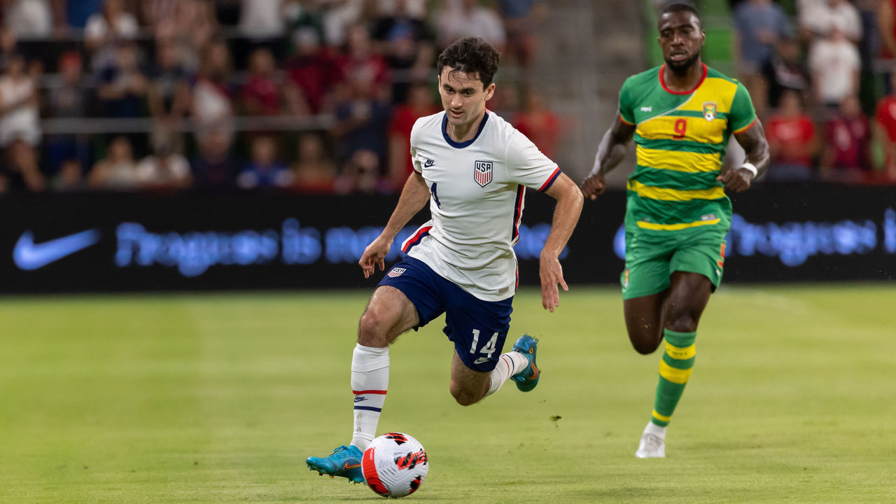 AUSTIN, TX - JUNE 10: United States midfileder Luca de la Torre (14) outruns Grenada forward Kharlton Belmar (9) during the CONCACAF Nations League game between Grenada and United States national teams on June 10, 2022 at Q2 Stadium in Austin, TX.
