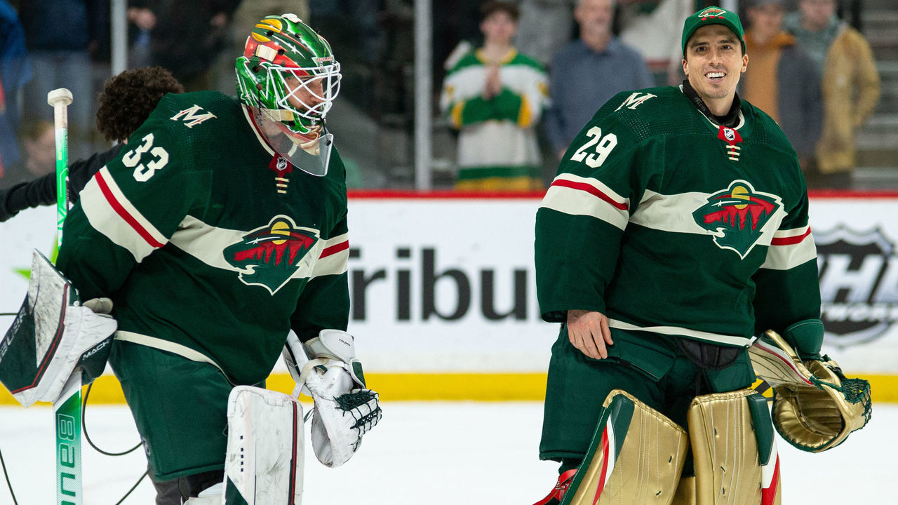 MINNEAPOLIS, MN - APRIL 12: Minnesota Wild Goalie Cam Talbot (33) and Minnesota Wild Goalie Marc-Andre Fleury (29) celebrate a win during the NHL game between the Edmonton Oilers and the Minnesota Wild on April 12th, 2022, at Xcel Energy Center in St. Paul, MN.