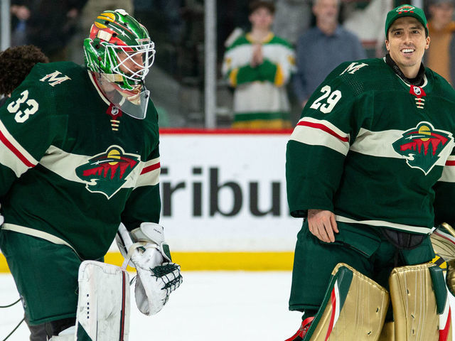 MINNEAPOLIS, MN - APRIL 12: Minnesota Wild Goalie Cam Talbot (33) and Minnesota Wild Goalie Marc-Andre Fleury (29) celebrate a win during the NHL game between the Edmonton Oilers and the Minnesota Wild on April 12th, 2022, at Xcel Energy Center in St. Paul, MN.