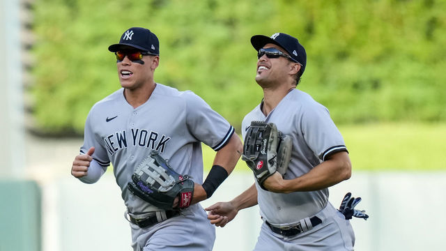 MINNEAPOLIS, MN - JUNE 08: Aaron Judge #99 of the New York Yankees looks on with Giancarlo Stanton #27 against the Minnesota Twins on June 8, 2022 at Target Field in Minneapolis, Minnesota.