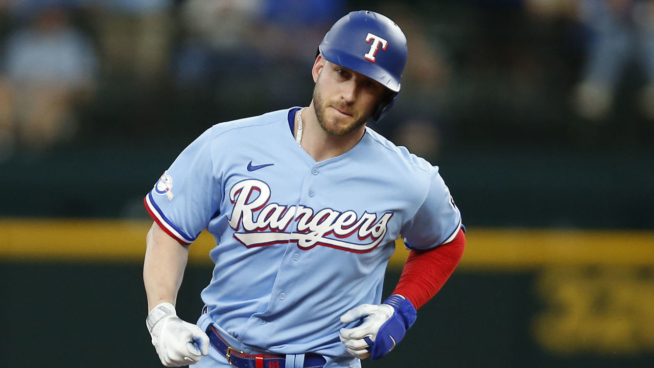 ARLINGTON, TEXAS - JUNE 05: Mitch Garver #18 of the Texas Rangers rounds the bases after hitting a home run in the game against the Seattle Mariners at Globe Life Field on June 05, 2022 in Arlington, Texas.
