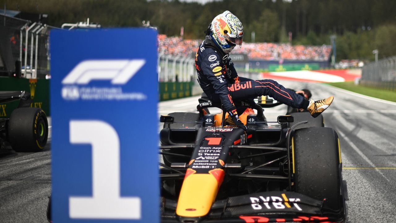 Red Bull Racing's Dutch driver Max Verstappen climbs out of his car after winning the sprint qualifying at the Red Bull Ring race track in Spielberg, Austria, on July 9, 2022, ahead of the Formula One Austrian Grand Prix.