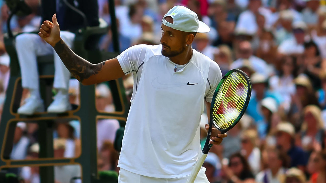 LONDON, ENGLAND - JULY 10: Nick Kyrgios of Australia gives a thumbs up to his team during hi9s match against Novak Djokovic of Serbia during day fourteen of The Championships Wimbledon 2022 at All England Lawn Tennis and Croquet Club on July 10, 2022 in London, England.