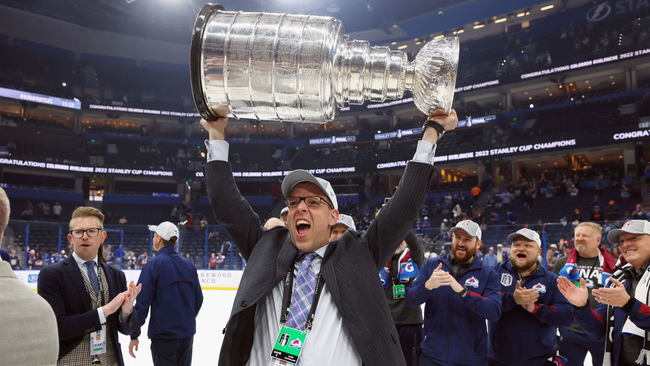 TAMPA, FLORIDA - JUNE 26: Chris MacFarland of the Colorado Avalanche carries the Stanley Cup following the series winning victory over the Tampa Bay Lightning in Game Six of the 2022 NHL Stanley Cup Final at Amalie Arena on June 26, 2022 in Tampa, Florida.