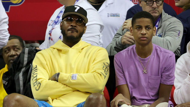 LAS VEGAS, NEVADA - JULY 11: Carmelo Anthony (L) and his son Kiyan Anthony attend a game between the Orlando Magic and the Oklahoma City Thunder during the 2022 NBA Summer League at the Thomas & Mack Center on July 11, 2022 in Las Vegas, Nevada.