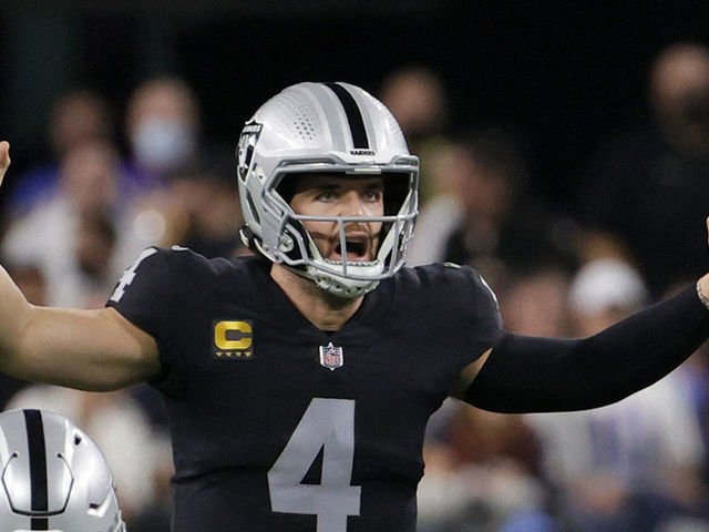 LAS VEGAS, NEVADA - JANUARY 09: Quarterback Derek Carr #4 of the Las Vegas Raiders gestures behind guard Alex Leatherwood #70 at the line of scrimmage during their game against the Los Angeles Chargers at Allegiant Stadium on January 9, 2022 in Las Vegas, Nevada. The Raiders defeated the Chargers 35-32 in overtime.