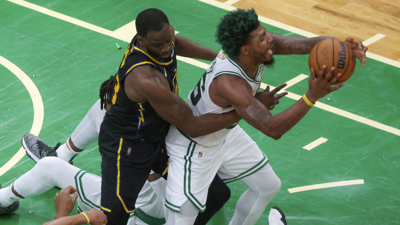Boston - June 8: Golden State Warriors forward Draymond Green (23) fouls out of the game as he grabs Boston Celtics guard Marcus Smart (36) and guard Stephen Curry (30) injured his foot on the play during fourth quarter action. The Boston Celtics hosted the Golden State Warriors for Game Three of the NBA Finals at the TD Garden in Boston on June 8, 2022.