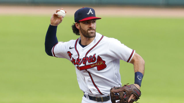 ATLANTA, GA - JULY 12: Dansby Swanson #7 of the Atlanta Braves throws to first during the first inning against the New York Mets at Truist Park on July 12, 2022 in Atlanta, Georgia.