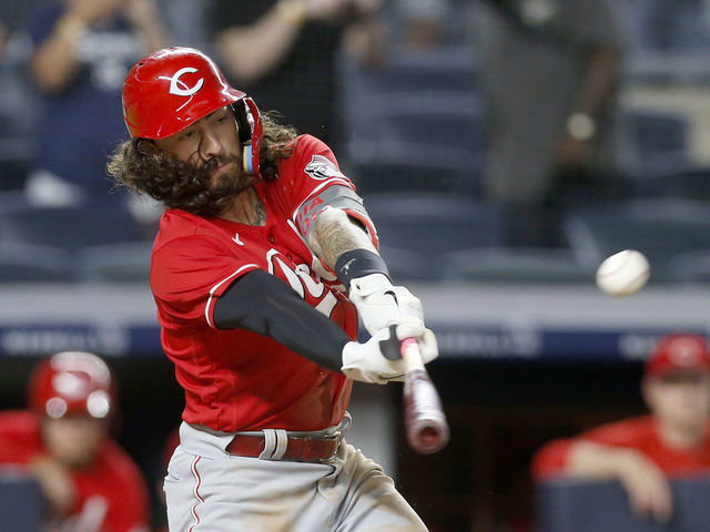 Cincinnati Reds' Jonathan India tosses his bat during a baseball