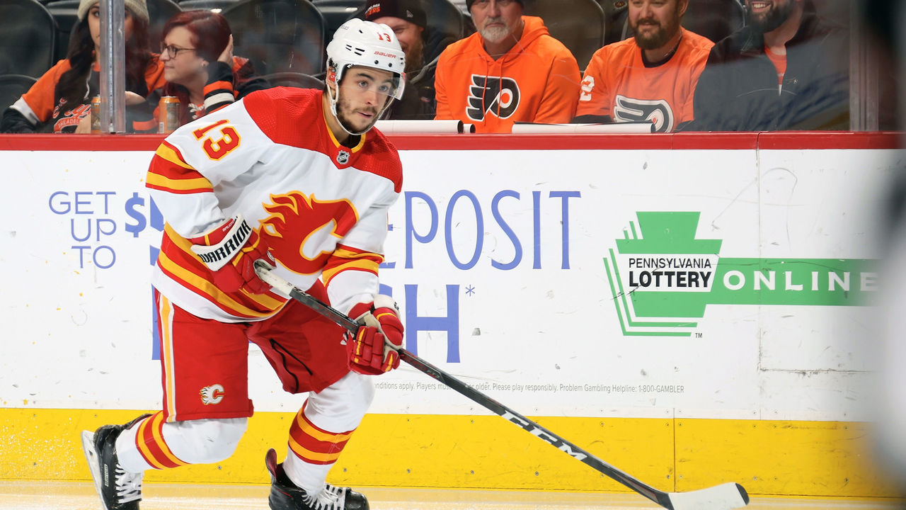 PHILADELPHIA, PA - NOVEMBER 16: Johnny Gaudreau #13 of the Calgary Flames skates the puck against the Philadelphia Flyers at the Wells Fargo Center on November 16, 2021 in Philadelphia, Pennsylvania.
