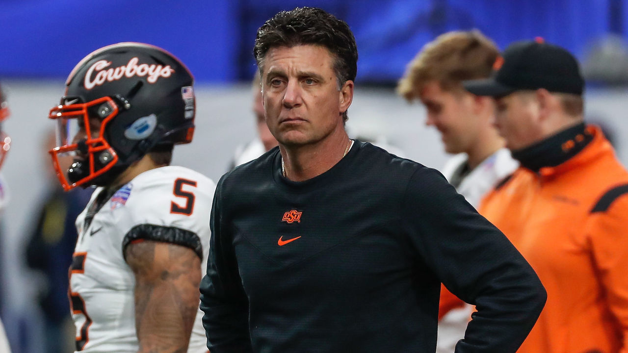 GLENDALE, AZ - JANUARY 01: Oklahoma State Cowboys head coach MIke Gundy looks on before the PlayStation Fiesta Bowl college football bowl game between the Notre Dame Fighting Irish and the Oklahoma State Cowboys on January 1, 2022 at State Farm Stadium in Glendale, Arizona.