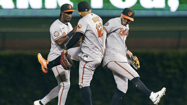 CHICAGO, ILLINOIS - JULY 13: (L-R) Jorge Mateo #3, Rougned Odor #12 and Ryan McKenna #26 of the Baltimore Orioles celebrate a 7-1 win over the Chicago Cubs at Wrigley Field on July 13, 2022 in Chicago, Illinois.